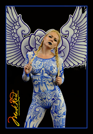 Blonde model in full body paint with long pigtails with a blue and white theme