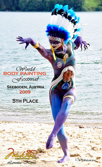 Blue themed full body painting on the beach
