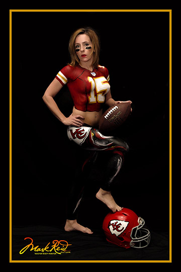 Long haired model in Kansas City football paint